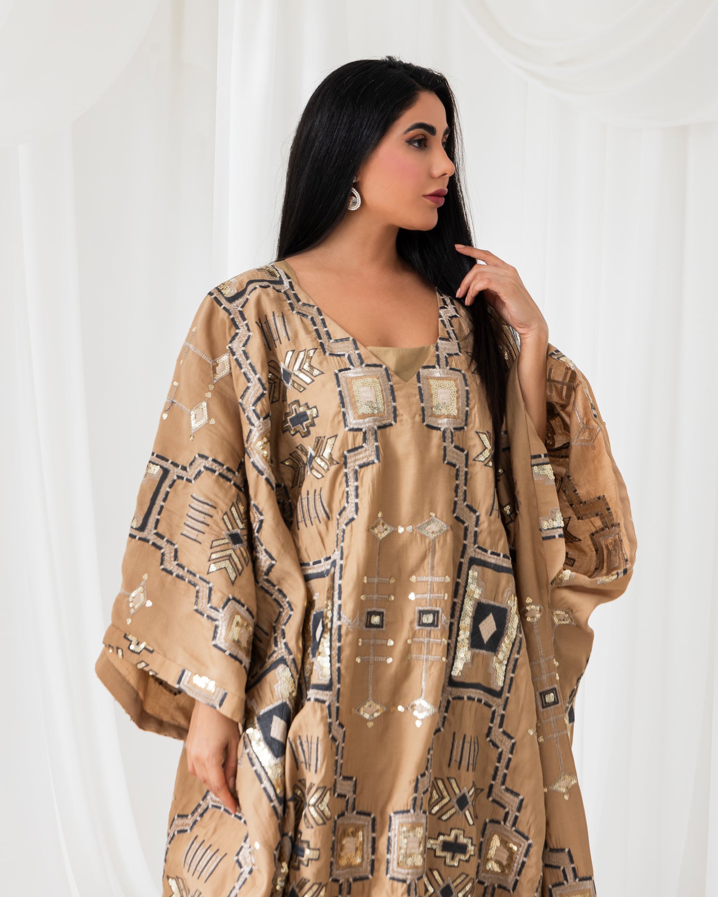 A radiant abaya that shines with confidence. Designed for the bold and beautiful