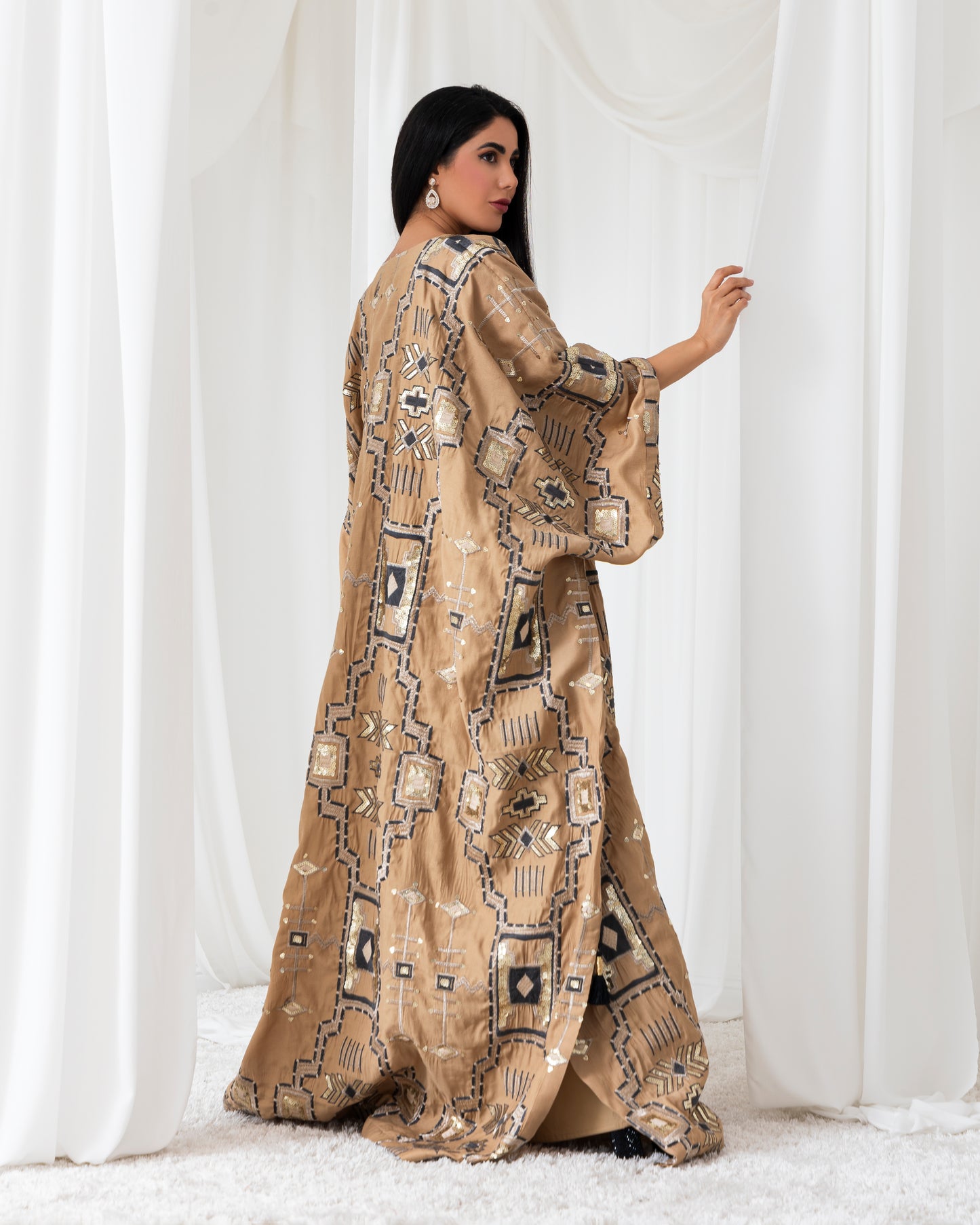 A radiant abaya that shines with confidence. Designed for the bold and beautiful